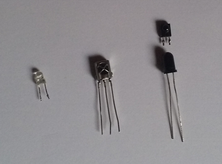 From left to right: A 3mm IR LED, a VS 1383B receiver and 2 photodiodes